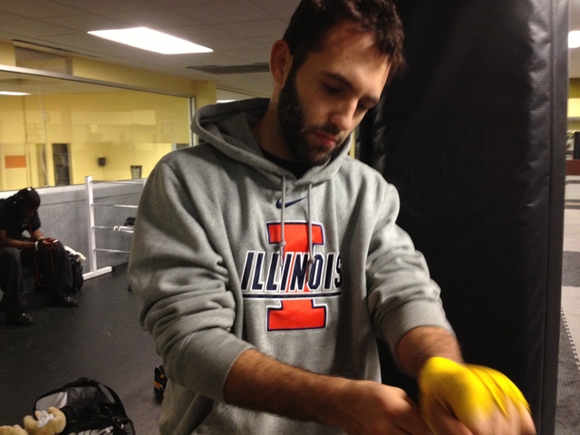 <p>Vaughn Camacho tapes his hands before a training session at Fitness Formula Club in Old Town.</p>
