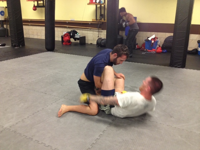 <p>Vaughn Camacho, left, trains with Tom Redmond at the Fitness Formula Club in Old Town.</p>
