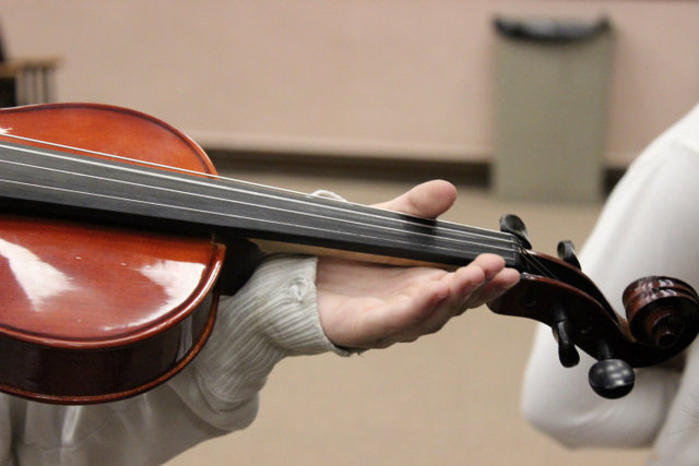 <p>Sean Reidy, orchestra director at Amundsen High School, secured funds to purchase child-sized instruments for elementary students to use during music lessons.</p>
