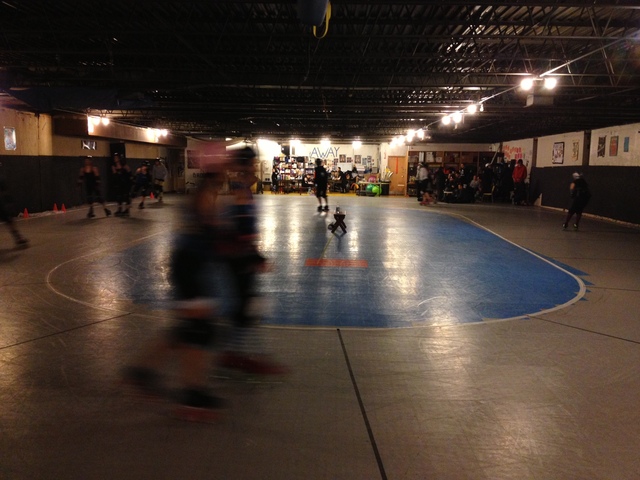 <p>The Windy City Rollers organization practices in a secret location in Humboldt Park. Danielle Henderson points at a part of the wall into which she skated, causing a triple fracture in her right ankle.</p>
