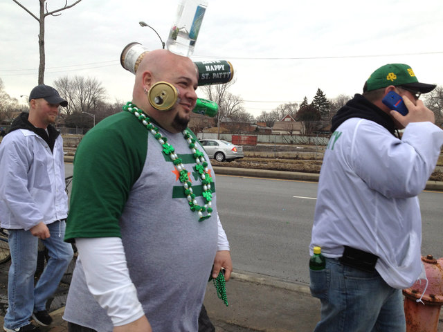 <p>Evergreen Park's Jamie Keeton, perhaps better known as "Can Head," makes an appearance at the parade. The 43-year-old suburban resident is famous for his apparently natural ability to keep bottles suctioned to his head.</p>
