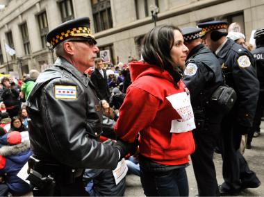 Thousands of people from groups across the political spectrum converged on Daley Plaza Wednesday afternoon to protest Chicago school closings.