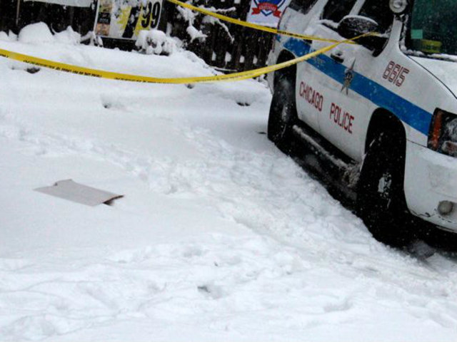 <p>Police roped off an area with footprints outside North Community Bank, 2000 W. Division St,, which was believed to have been robbed by the "Mummy Bandit" Tuesday, officials said.</p>
