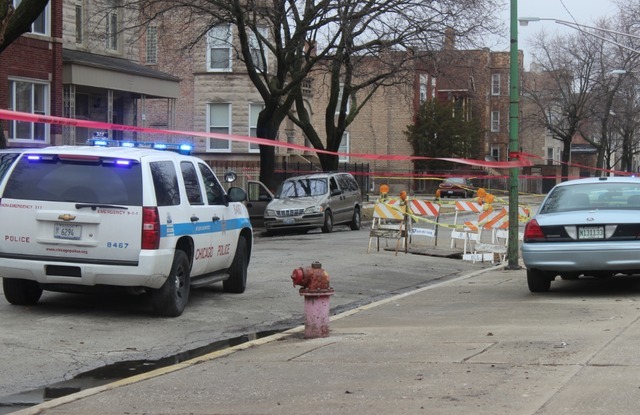 <p>Police investigate the scene of the Woodlawn shooting in the 6500 block of South Maryland Avenue Monday, March 11, 2013.</p>
