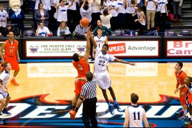 Francis Parker freshman Marc Taylor (No.22) tips it off as the Colonels take on Latin School at DePaul University.