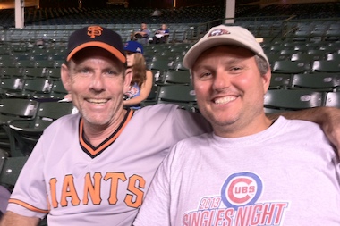  Shortly after midnight, brothers-in-law John Bellone and Jim Trembley wait out the lengthy delay at Wrigley Field on August 19th, 2014.  