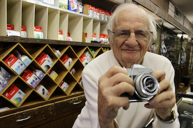 Joe Herbert, 90, still mans the counter at his little store — one of the city’s last surviving independent photo shops — and has no plans to close up shop after 70 years.