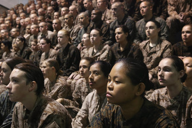 Female and male Marine recruits listen to instructions as they prepare for a swimming test during boot camp February 25, 2013 at MCRD Parris Island, South Carolina.