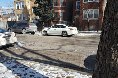 Neighbors say that Reggie Bonner was sitting in a car in the 1100 block of North Springfield Avenue when he was shot.