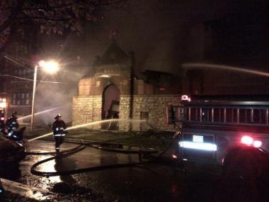 Firefighters battle an extra-alarm fire at Love, Faith and Praise Church of God in Christ, 6948 S. Stewart Ave., in Englewood early Friday.