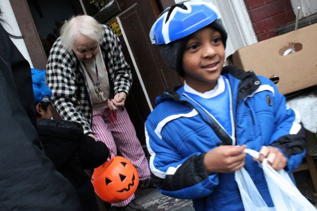 <p>A young boy leaves Marcella's house after a trick-or-treating stop.</p>
