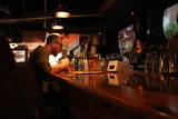 <p>Ryan McBride enjoys a slice of pizza and a PBR at the Boiler Room in Logan Square.</p>
