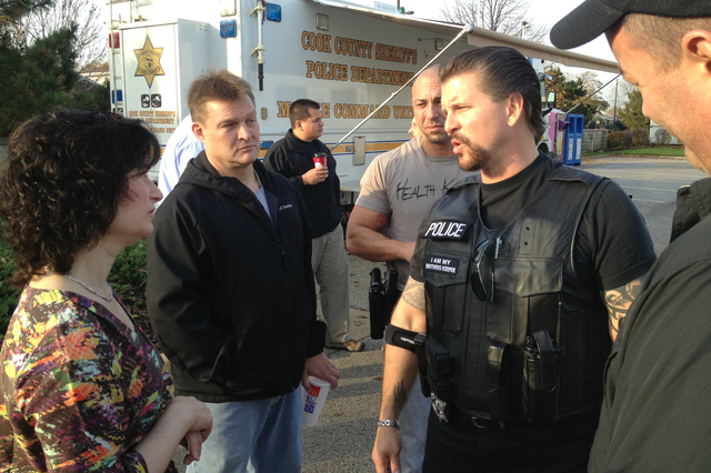<p>Alderman Debra Silverstein talks with an officer outside a Cook County Sheriff's Office Mobile Command Unit during a similar sting operation at the end of October.</p>
