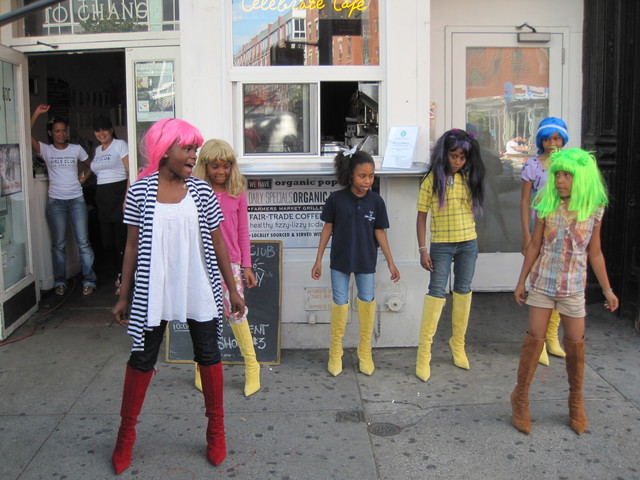 <p>LES Girls Club members put on a dance performance in front of their new Celebration Cafe on the Bowery.</p>
