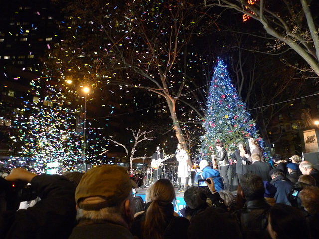 <p>A blast of confetti marked the lighting of a 27-foot Christmas tree at Dante Park to kick of Winter's Eve.</p>
