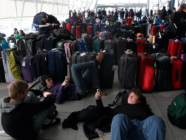 <p>Young travelers rest near dozens of suitcases while stranded at Terminal 4 following a major blizzard at John F. Kennedy International Airport December 27, 2010 in the Queens borough of New York City. A massive snowstorm crippled much of the Northeastern United States leaving up to a foot of snow for New York City and New England and left millions of holiday travelers stuck at airports and train stations around the eastern seaboard.</p>
