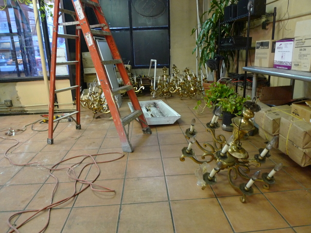 The chandeliers that once hung on H&H Bagels ceiling were replaced with flourescent lights on Monday.