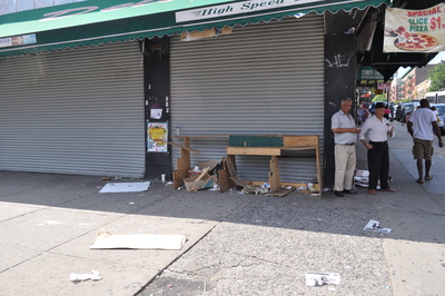 Piles of trash and a vandalized display area are all that is left of a former pizza parlor on 207th Street and Vermilyea Avenue.