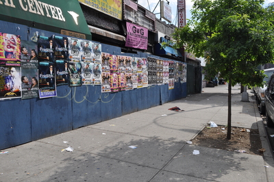 Trash flies around street corners in Inwood.