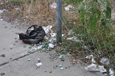 An empty lot on Broadway, between Academy and 204th streets, is often the site of trash accumulations.