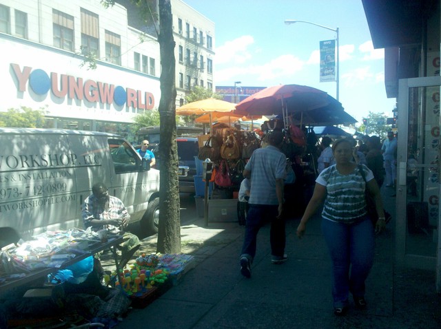 Many residents and shop owners say vendors clog sidewalks and take away sales.