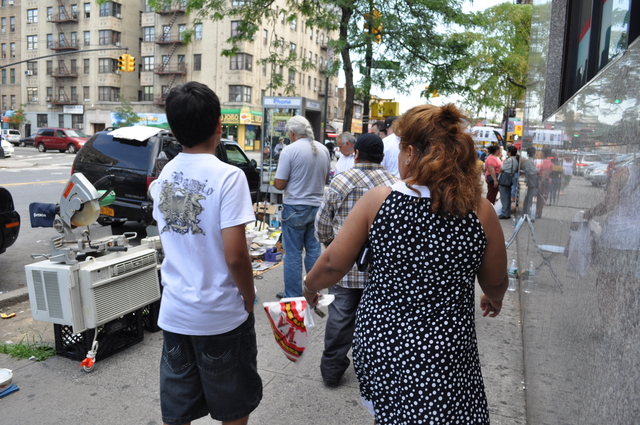 Street vendors make it difficult to navigate the sidewalks, residents say.