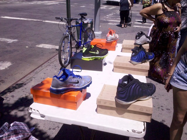 Sneakers are sold on a table on St. Nicholas Avenue.