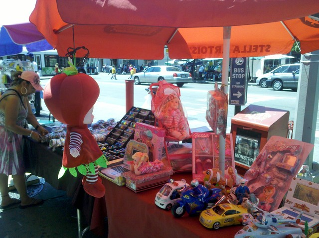 Childrens toys are sold at a stand on St. Nicholas Avenue. 