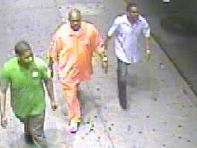 This is the suspect (center) and men police are looking to question in an attempted rape on Eighth Avenue and West 36th Street on July 15, 2011.