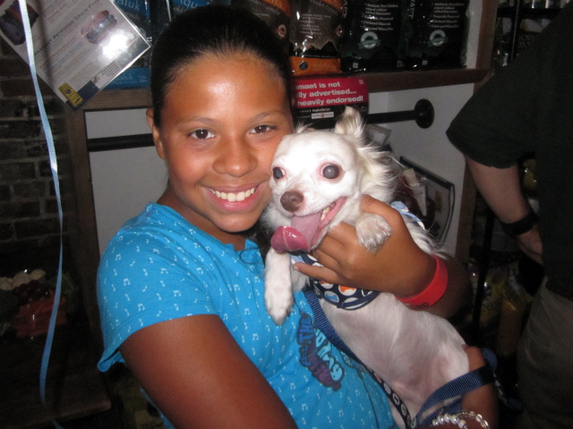 Mia, 11, held her dog Prince. 