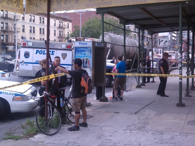 Police talk to a passerby.