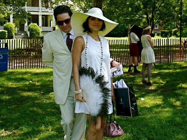 Felix and Morgan in shades of white suited for a lawn party. Her peacock feather fan is the ideal accessory. 