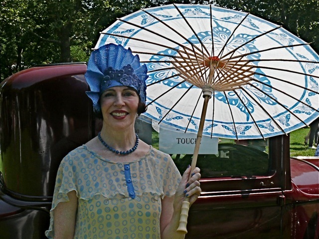 Milliner and designer Gretchen Fenston in a free-form cloche hat, which was another direct reaction to the Art Deco styling of women's fashion. 