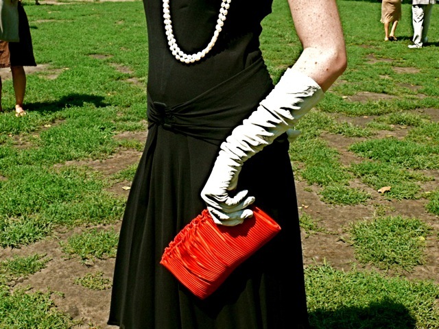 Elbow length white kid gloves. 