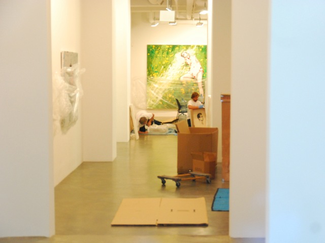 Workers at the Mike Weiss Gallery pack up in preparation for Hurricane Irene.