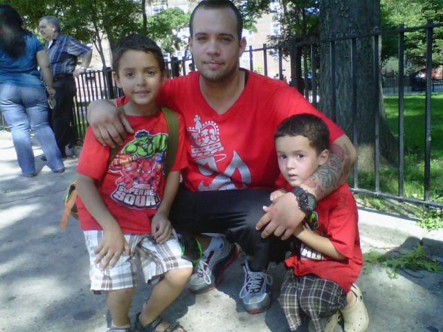 Jacob Riis Houses resident Julio Pinero and his sons Brandon (l.) and Jonathan prepared to leave for the Bronx.