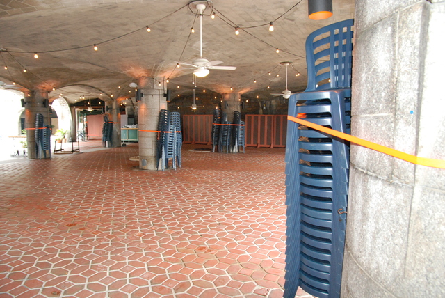 Employees at the Boat Basin Cafe near West 79th Street tied down chairs in preparation for Hurricane Irene.