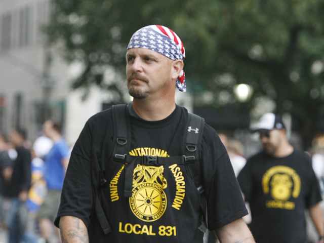 A member of the Teamsters wears patriotic head wear prior to the 10th Anniversary of the 9/11 terrorist attacks during the Labor Day Parade on Fifth Avenue on Sept. 10, 2011.