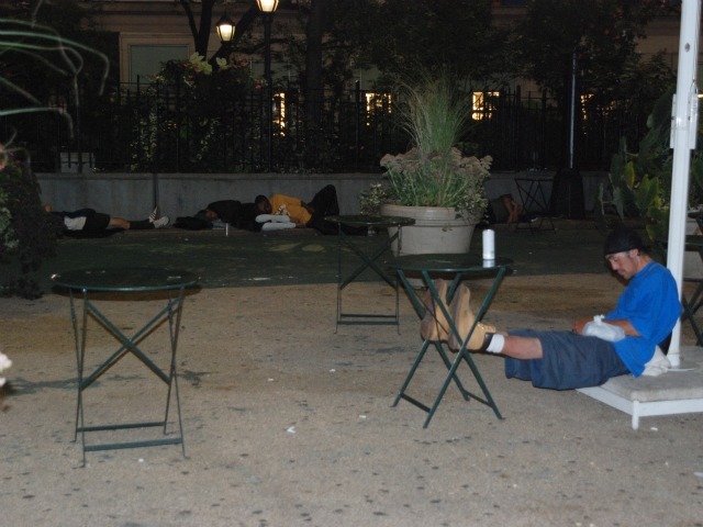 Men sleep in the plaza space directly in front of Macy's Herald Square, Tuesday, Sept. 13.