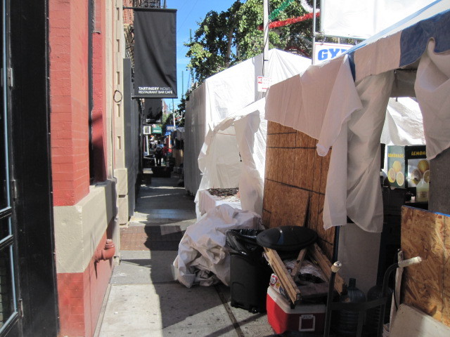 Sidewalks in front of shops on Mulberry Street next to the San Gennaro festival.