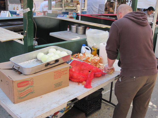 Peeling onions at the San Gennaro festival on Fri., Sept. 16, 2011.