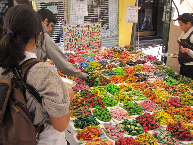 Visitors comb through goodies on sale at the San Gennaro Festival on September 16, 2011.