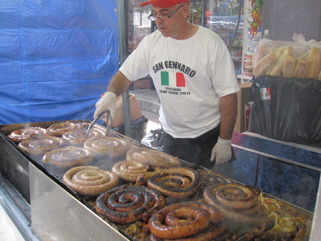 Tony Guadino cooks up sausage at his family's 40-year-old stand on Mulberry Street for the San Gennaro festival on Fri., Sept. 16, 2011.