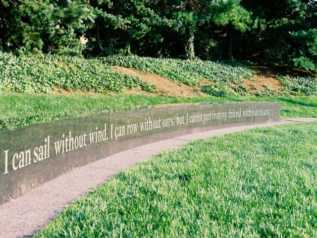 Words engraved in a granite bench in Hudson River Park near West 11th Street commemorate people who have died of AIDS and those who care for them.