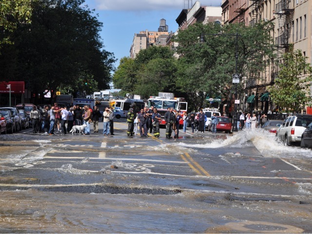 Pedestrians watched in amazement as water gushed onto Central Park West.