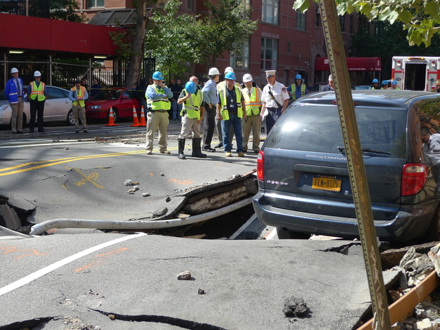 Crews towed a minivan out of the way so they could dig up the street to investigate a broken water main at West 106th Street and Central Park West.
