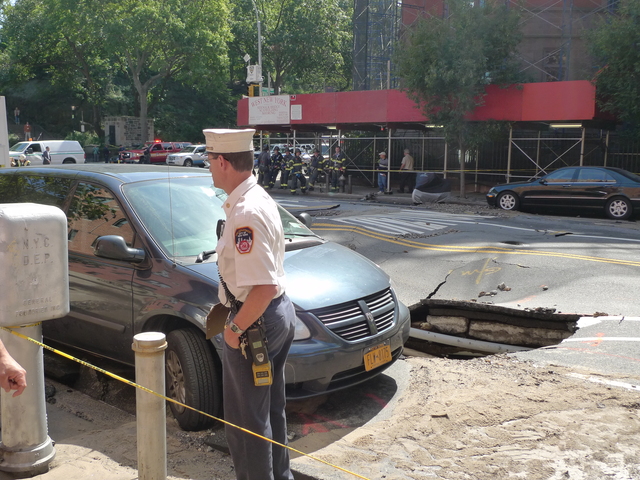 After the water main was turned off, crews went to work digging up the street. This minivan was moved out of the way.