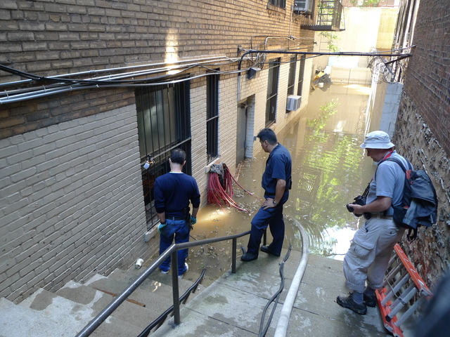 The rear courtyard of 467 Central Park West was flooded after a water main break near West 106th Street.