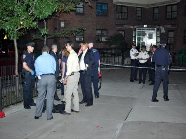 Investigators searched the scene of the shooting incident in East Harlem.