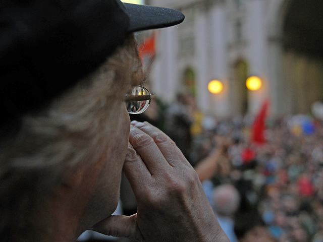 A woman protester address the crowd. 